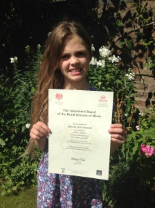 Gracie & her Grade 1 Distinction Certificate